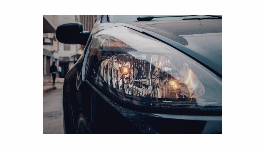 Dimmed headlights of a car