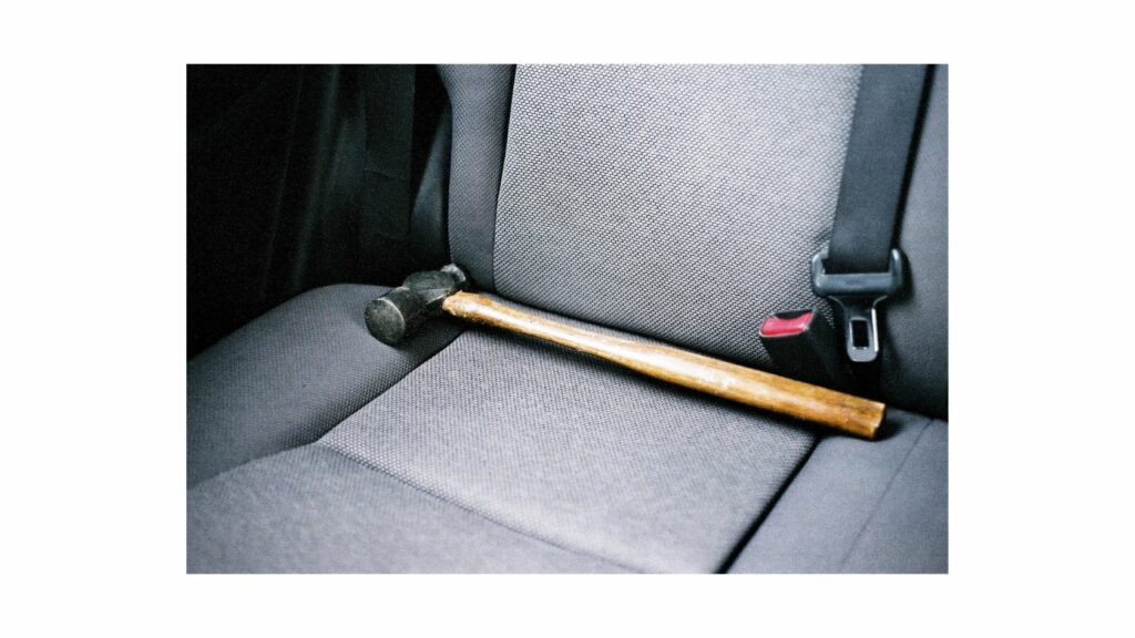 A hammer on the car seat