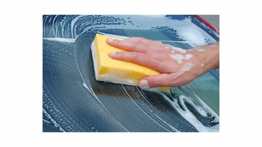 Cleaning a car with sponge