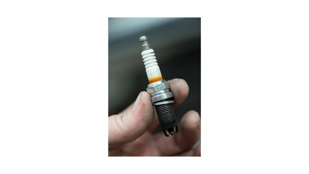 Holding a spark plug