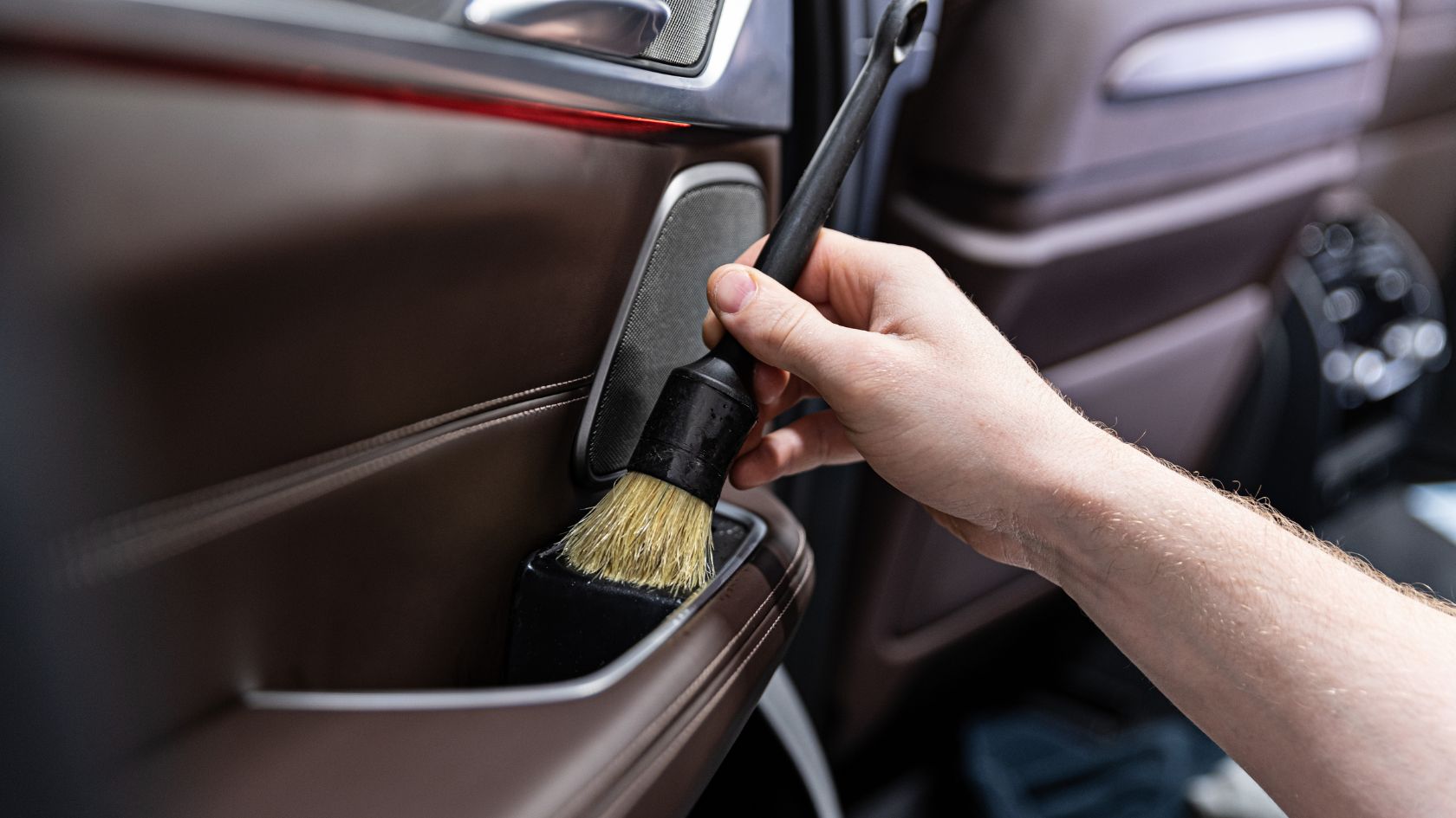 Cleaning Car Door Panels With A Brush