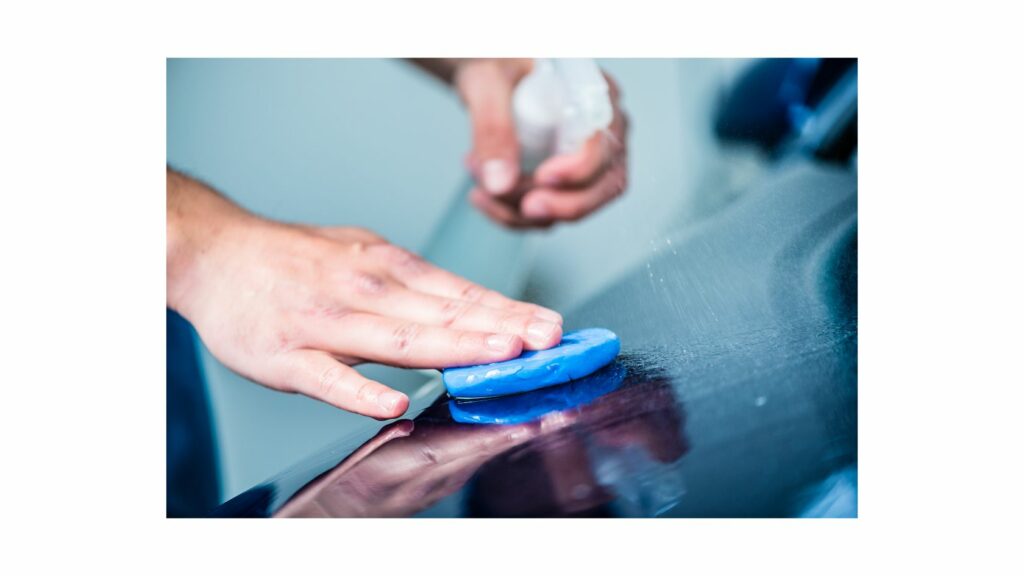 Cleaning a car with wax