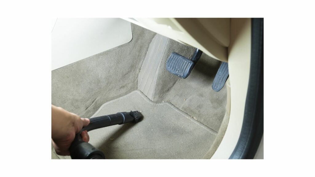 Vacuuming Car Carpet With Specialized Attachment