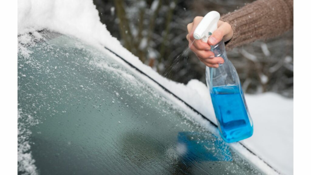 Spraying Car Windshield with Anti-fog Spray