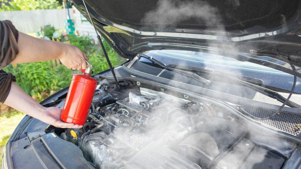 Dousing Car Fire Using a Fire Extinguisher