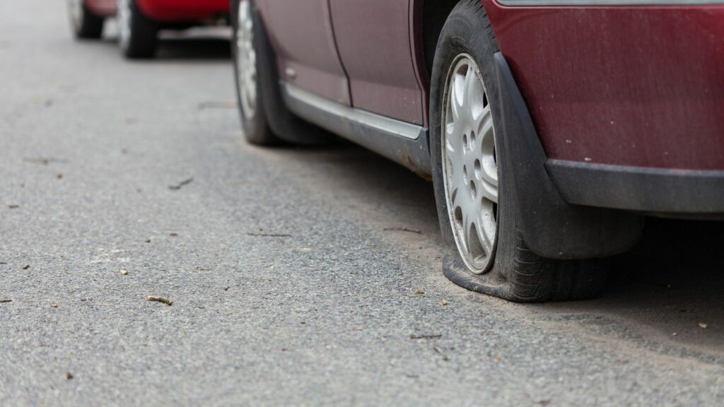 Car Running on Flat Tire