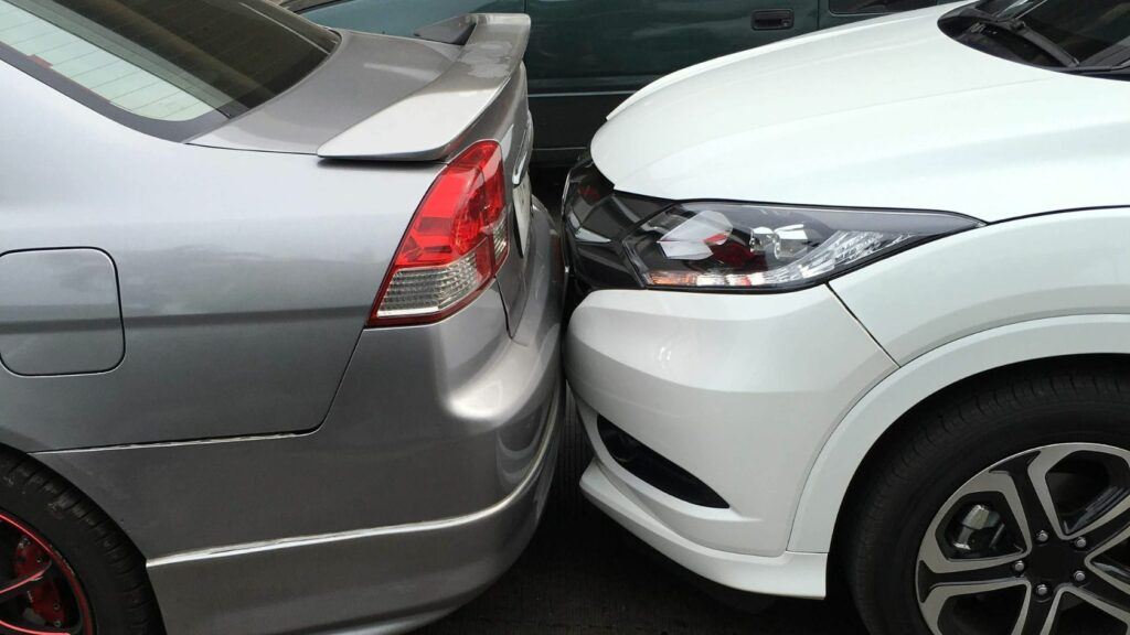 A Car Touching Another Cars Rear