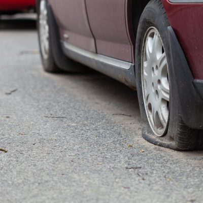 Car Running on Flat Tire
