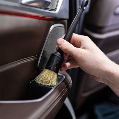 Cleaning Car Door Panels With A Brush