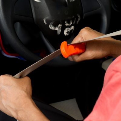 Cutting The Seat Belt With A Car Emergency Escape Tool