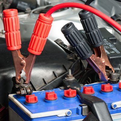 Jumper Cable Connected To A Car Battery