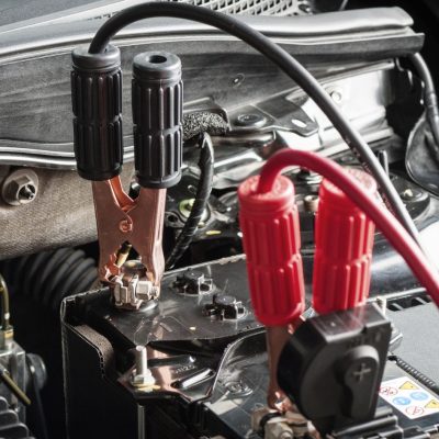 Jumper Cable Connected To The Car Battery