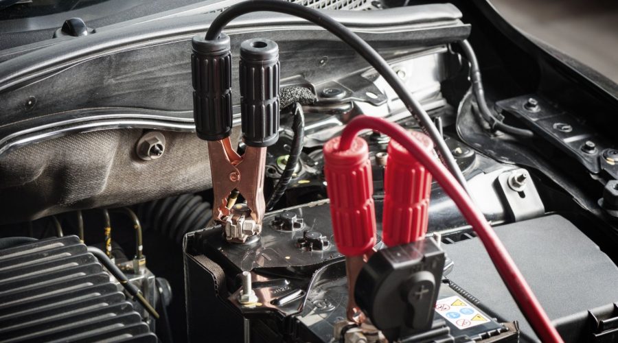 Jumper Cable Connected To The Car Battery