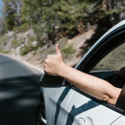 Thumbs Up from A Car Window