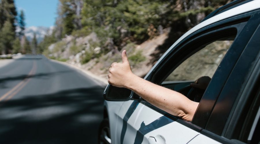 Thumbs Up from A Car Window