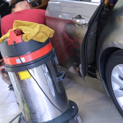 Vacuum Cleaner Near Car Door