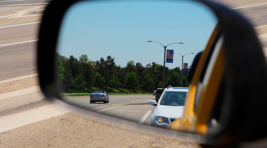 Vehicle Appearing In Car Side Mirror